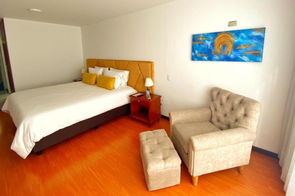 Postel nebo postele na pokoji v ubytování Pop Art Hotel Las Colinas Manizales