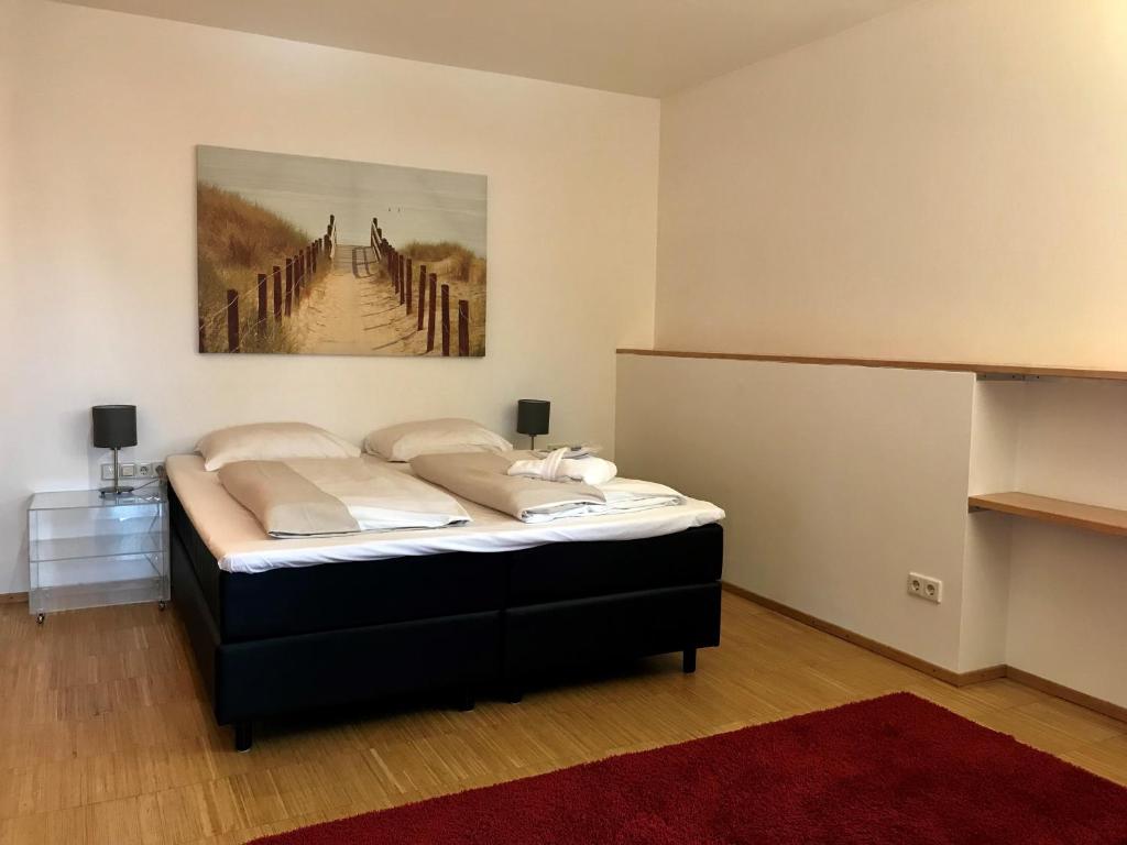 Postel nebo postele na pokoji v ubytování Parkhotel Hall in Tirol