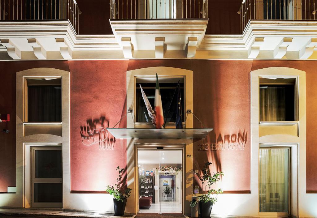 a facade of a building with plants in front of it at Hotel 33 Baroni in Gallipoli