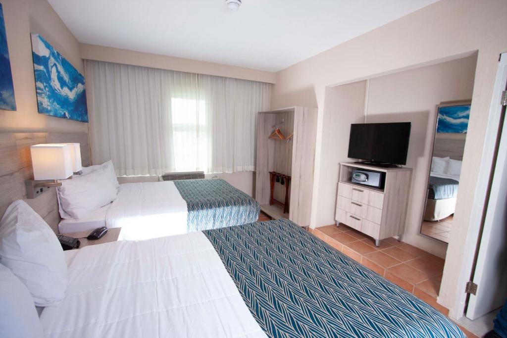 Postel nebo postele na pokoji v ubytování Punta Borinquen Resort