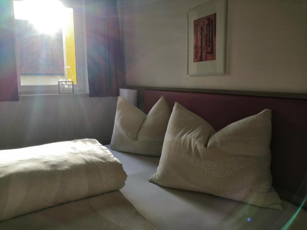 Postel nebo postele na pokoji v ubytování Hotel Mauernböck