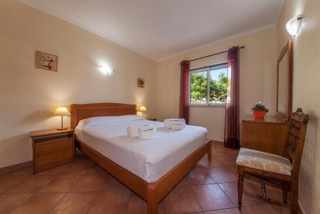 Postel nebo postele na pokoji v ubytování D07 - Torraltinha Villa in Lagos