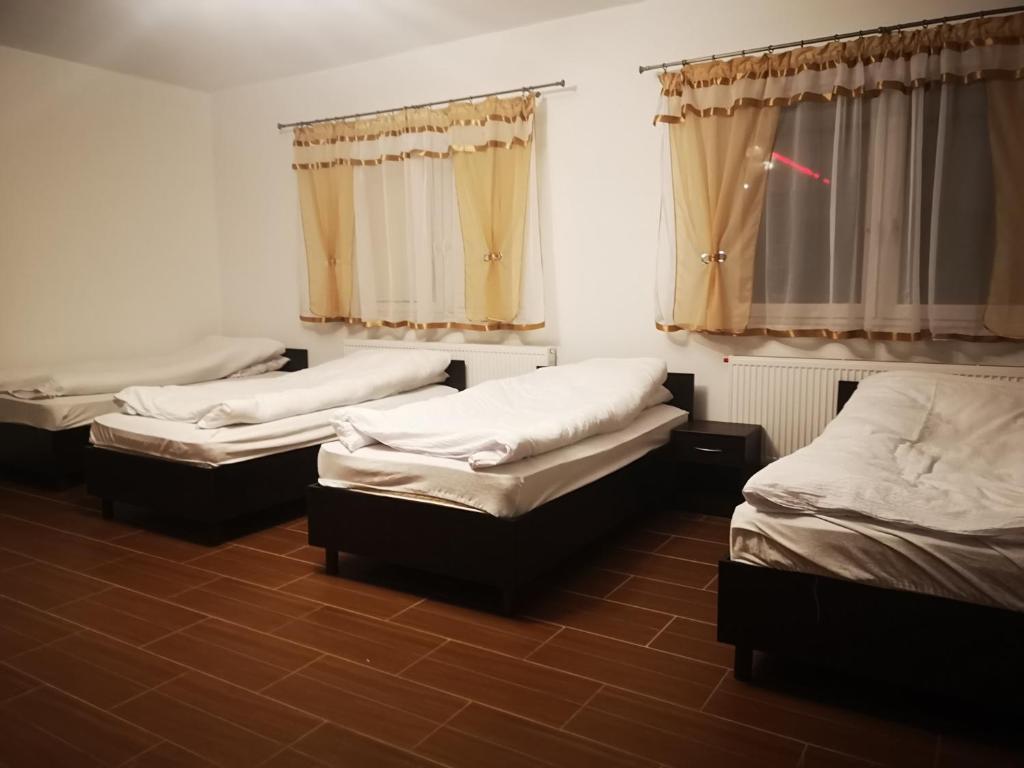 Posteľ alebo postele v izbe v ubytovaní Pokoje o wysokim standardzie
