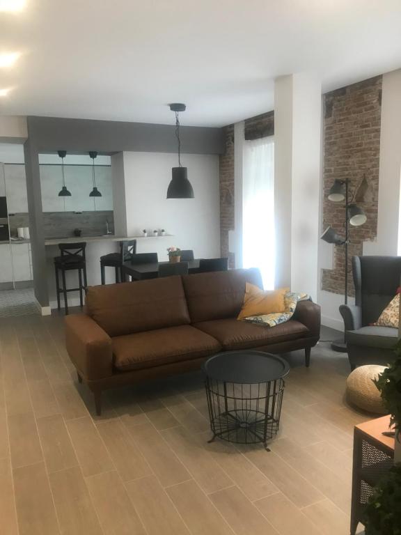 A seating area at Apartamentos DUKE