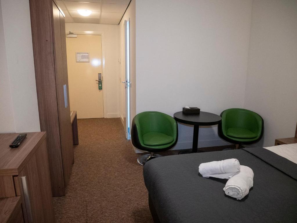 Postel nebo postele na pokoji v ubytování Hotel Hague Center