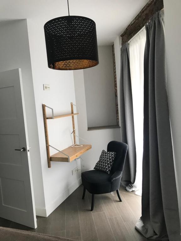 A seating area at Apartamentos DUKE