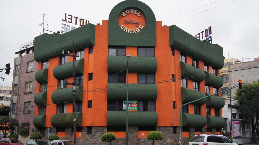 a large building with a clock on the side of it at Hotel Muy - Adults-Only in Mexico City