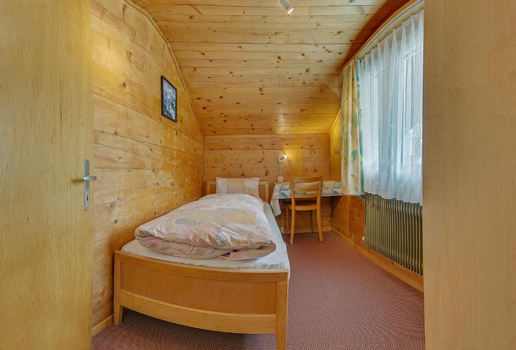 Postel nebo postele na pokoji v ubytování Anemone