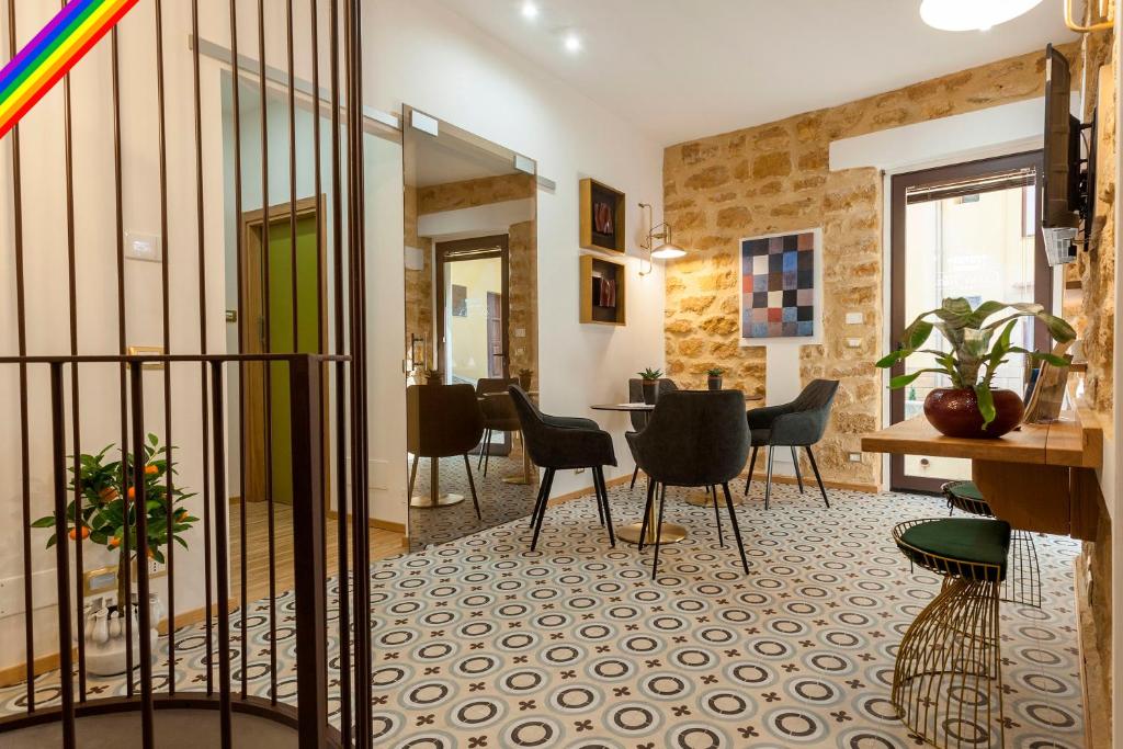 a room with chairs and a table in a building at Casa Tita in Agrigento