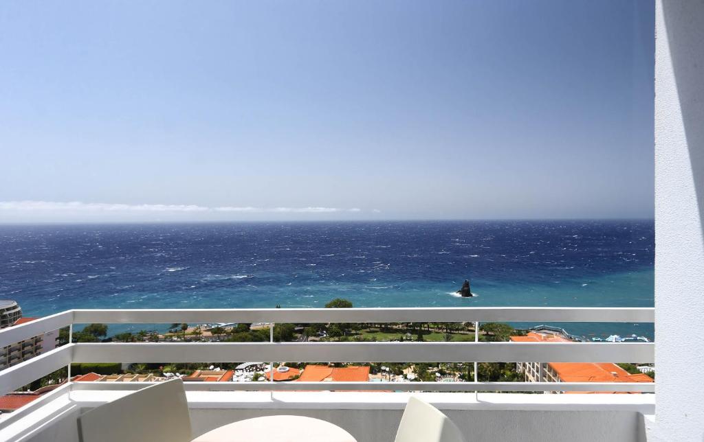 a view of the ocean from the balcony of a resort at Muthu Raga Madeira Hotel in Funchal
