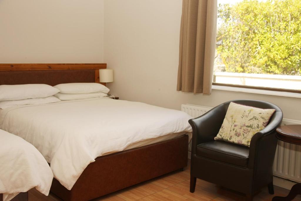 Postel nebo postele na pokoji v ubytování Torine House B&B