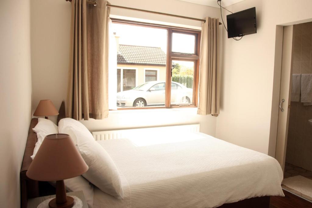 Postel nebo postele na pokoji v ubytování Torine House B&B