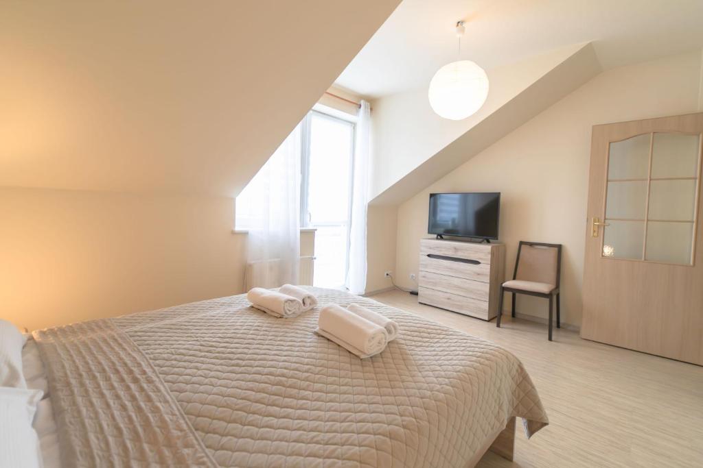 Posteľ alebo postele v izbe v ubytovaní Apartament Perłowy z balkonem- Dream Apart