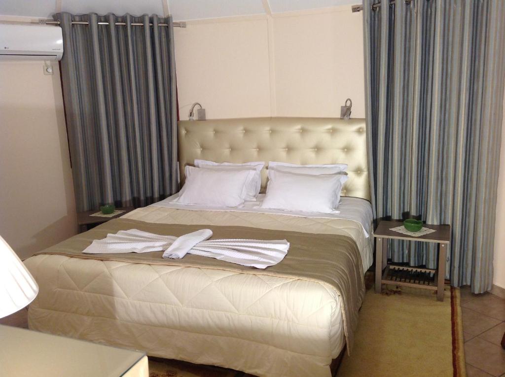 Posteľ alebo postele v izbe v ubytovaní Chrissa Camping Rooms & Bungalows