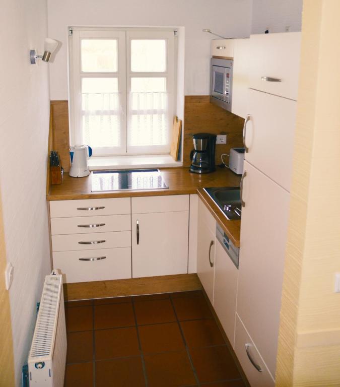Kuchyň nebo kuchyňský kout v ubytování Haus Meerforelle
