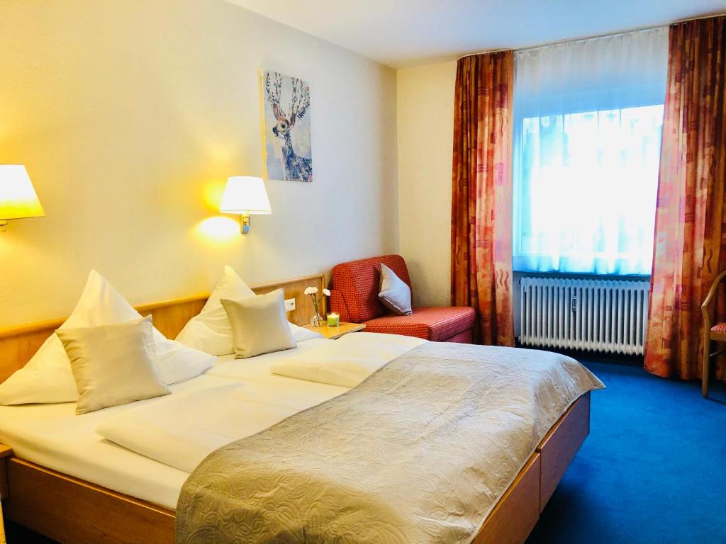 Postel nebo postele na pokoji v ubytování Hotel Austria Stuttgart-City
