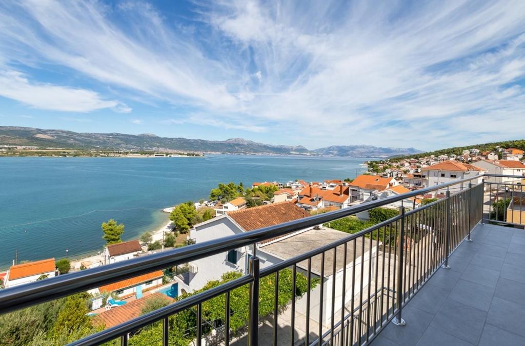 a balcony with a view of a body of water at Apartments Petar - great location close to the sea in Trogir