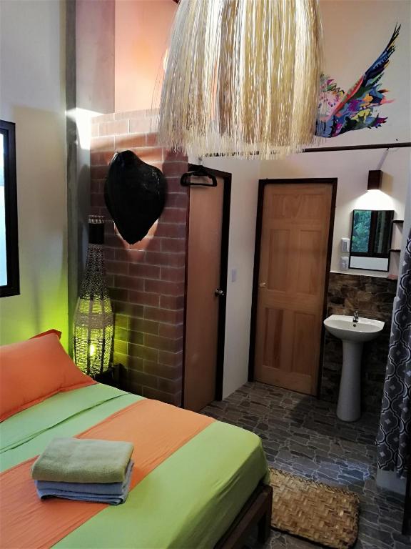 Postel nebo postele na pokoji v ubytování Hostal Oloncito
