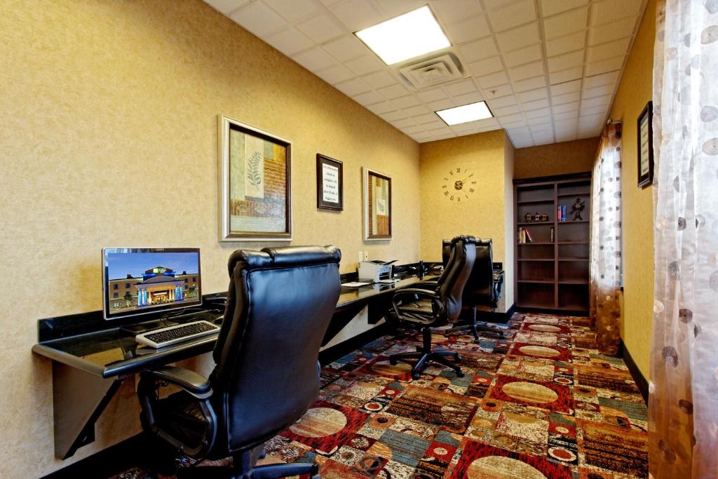 an office with two desks with chairs and a computer at Holiday Inn Express Hotel and Suites - Odessa, an IHG Hotel in Odessa