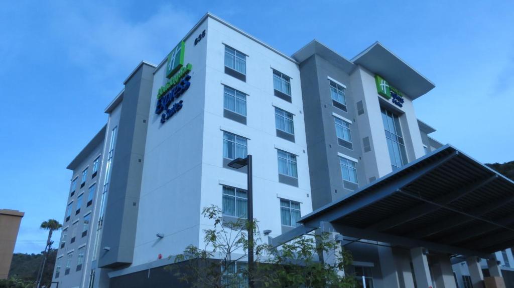 a white building with a sign on it at Holiday Inn Express & Suites San Diego - Mission Valley, an IHG Hotel in San Diego