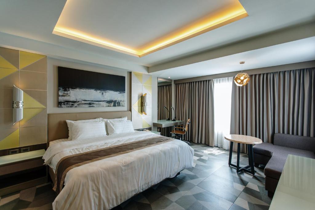 Postel nebo postele na pokoji v ubytování Zuri Hotel