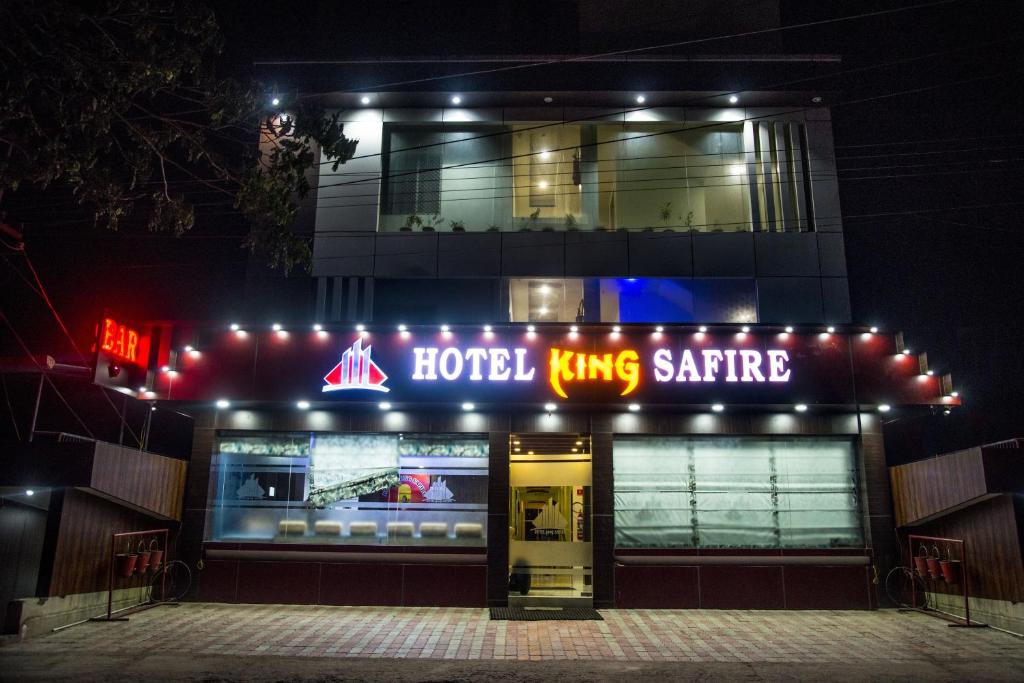 a hotel king safe is lit up at night at Hotel King Safire in Port Blair