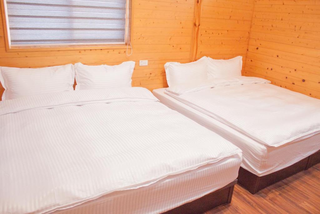 Postel nebo postele na pokoji v ubytování Yellow Mountain Homestay