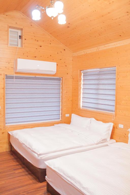 Postel nebo postele na pokoji v ubytování Yellow Mountain Homestay