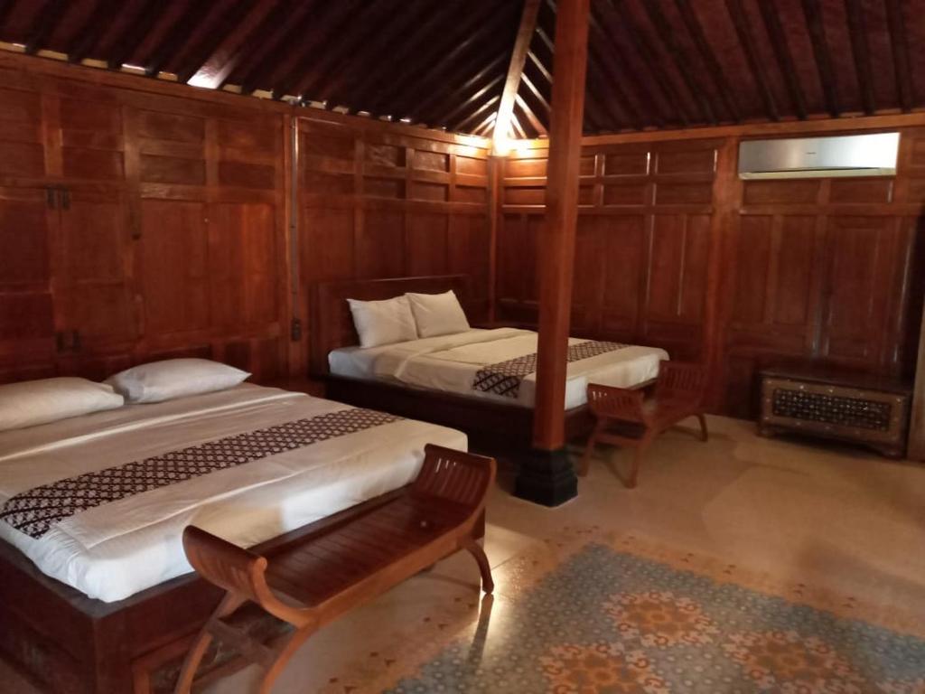 Voodi või voodid majutusasutuse Buana Ecofarm Ecolodge toas