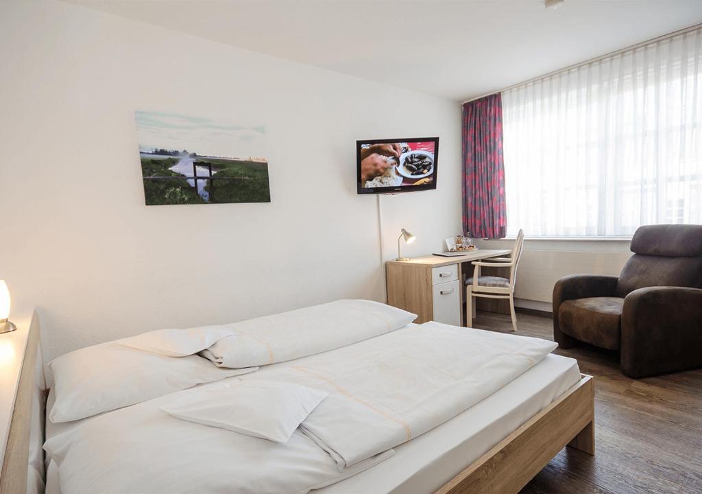 Postel nebo postele na pokoji v ubytování Hotel Lange