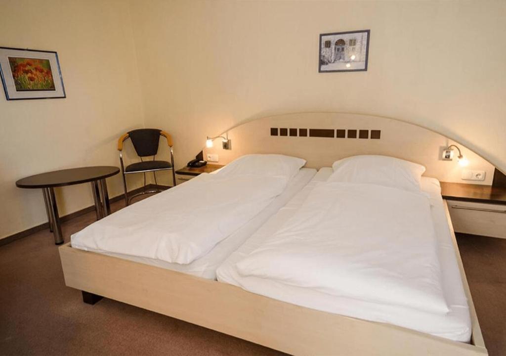 Postel nebo postele na pokoji v ubytování Hotel Lange