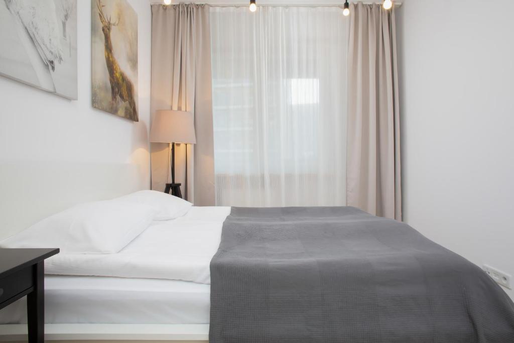Posteľ alebo postele v izbe v ubytovaní Apartment Warsaw Żoliborz by Noclegi Renters