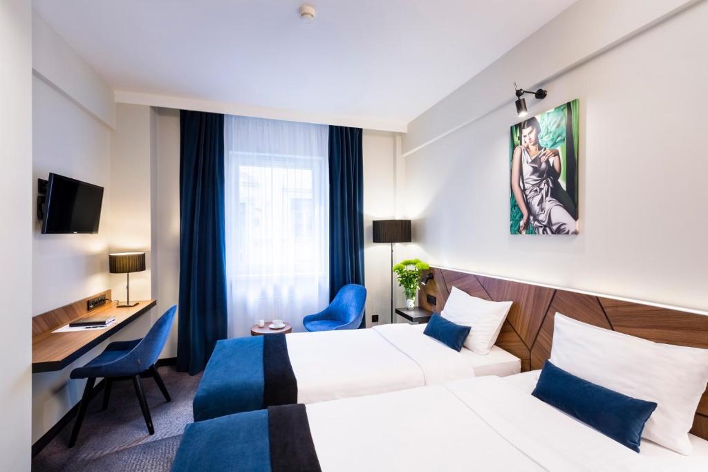 Posteľ alebo postele v izbe v ubytovaní Ascot Premium Hotel