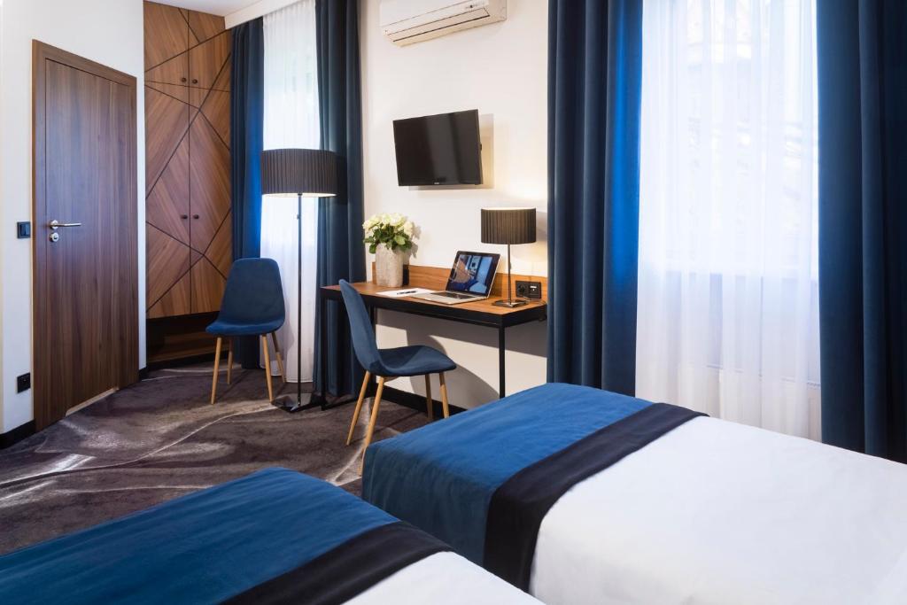 Posteľ alebo postele v izbe v ubytovaní Ascot Premium Hotel