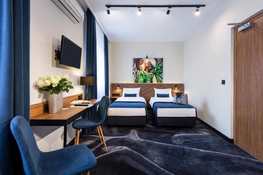 Posteľ alebo postele v izbe v ubytovaní Ascot Premium Hotel