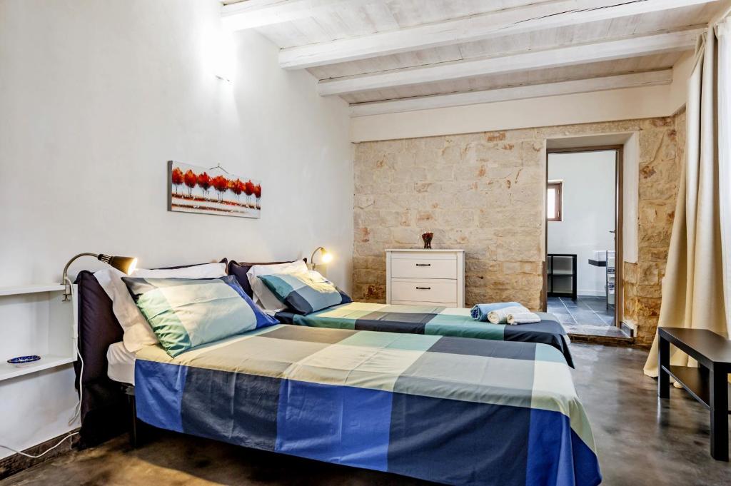 Łóżko lub łóżka w pokoju w obiekcie Villa Antica Aia Relax