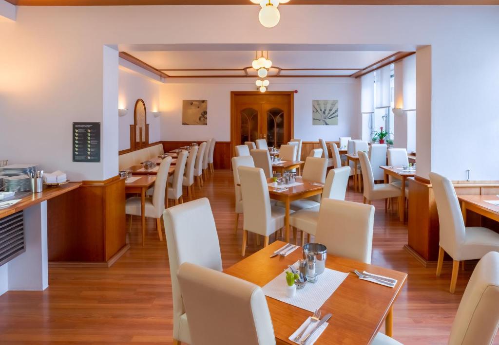TV a/nebo společenská místnost v ubytování Hotel Astor