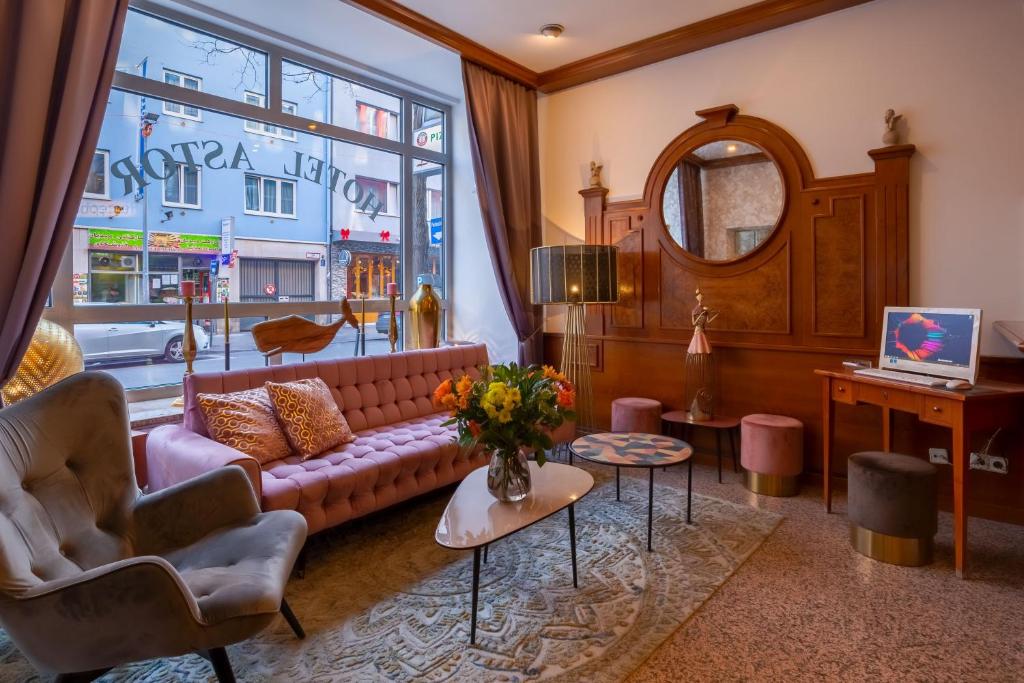 TV a/nebo společenská místnost v ubytování Hotel Astor