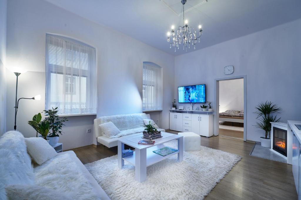 a living room with a couch and a table at Apartmán BB centrum in Banská Bystrica