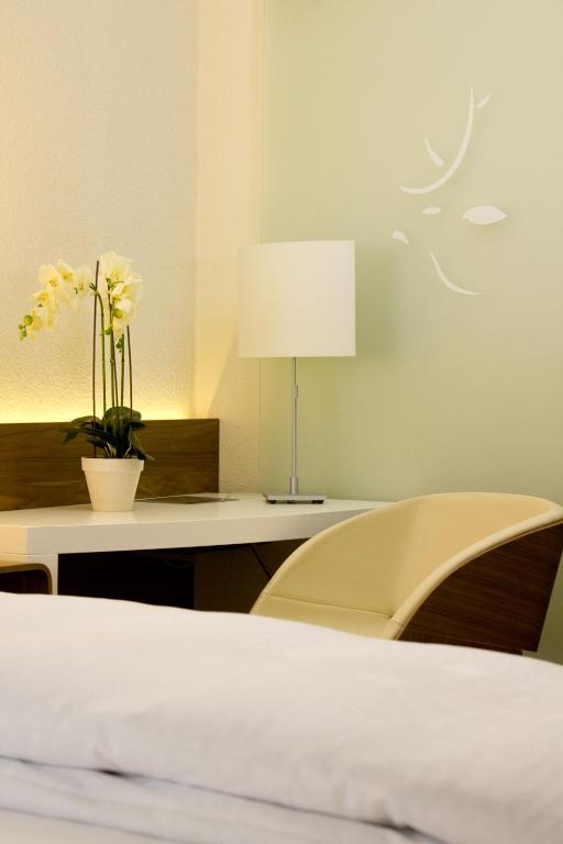 Postel nebo postele na pokoji v ubytování Hôtel-Restaurant du Cerf