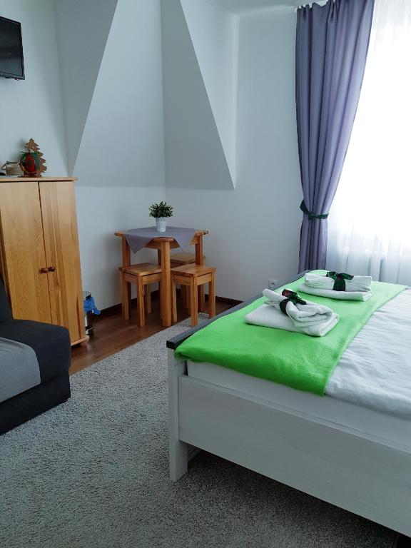 Postel nebo postele na pokoji v ubytování Pokoje u Agi