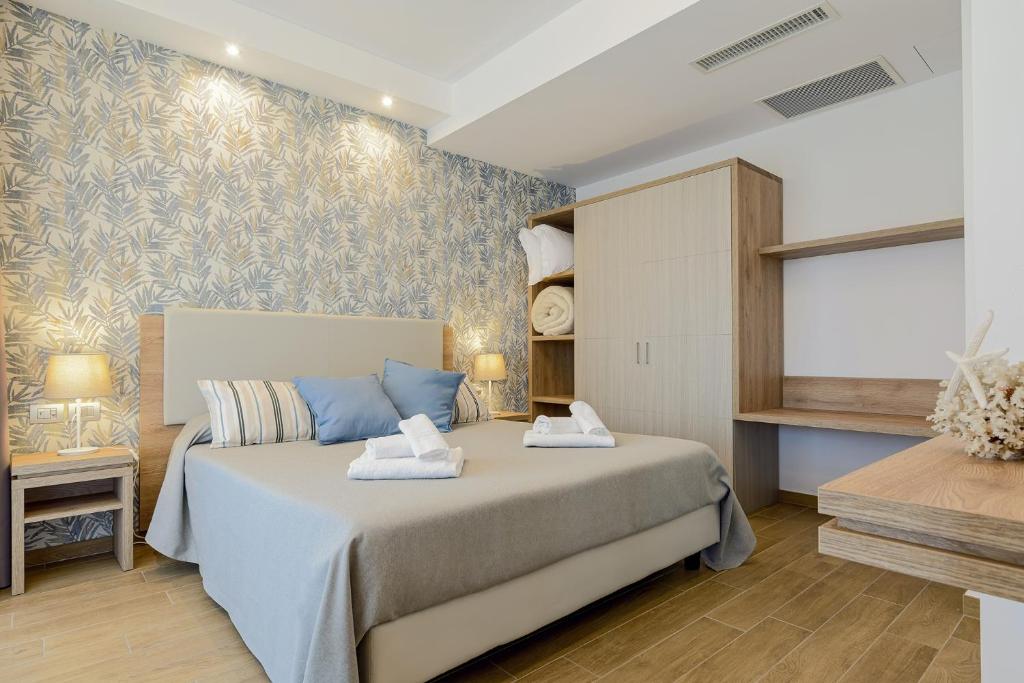 Postel nebo postele na pokoji v ubytování Hotel Serenella