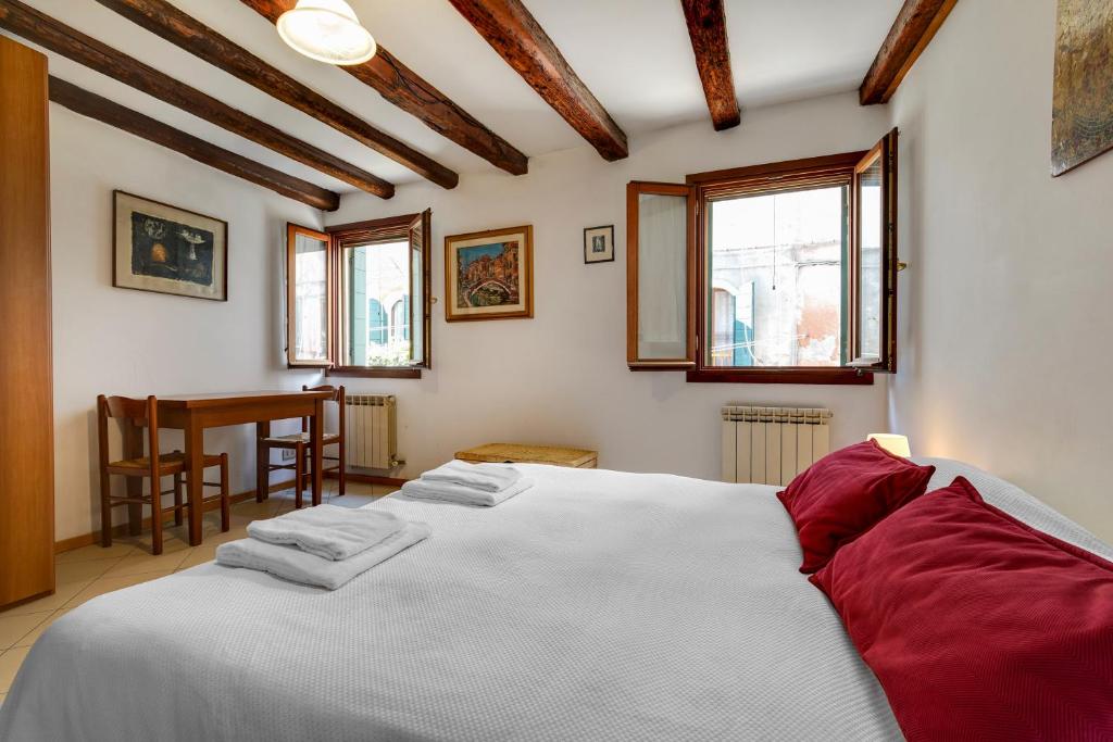 Postel nebo postele na pokoji v ubytování B&B Giardini