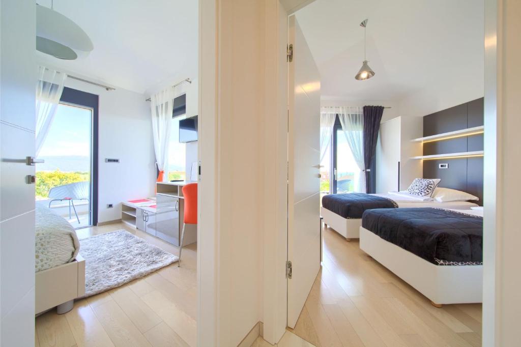 Postel nebo postele na pokoji v ubytování Villa ELA - Town Krk