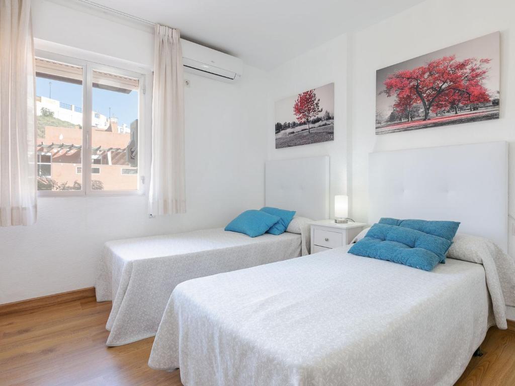 Postel nebo postele na pokoji v ubytování Belvilla by OYO Cozy apartment
