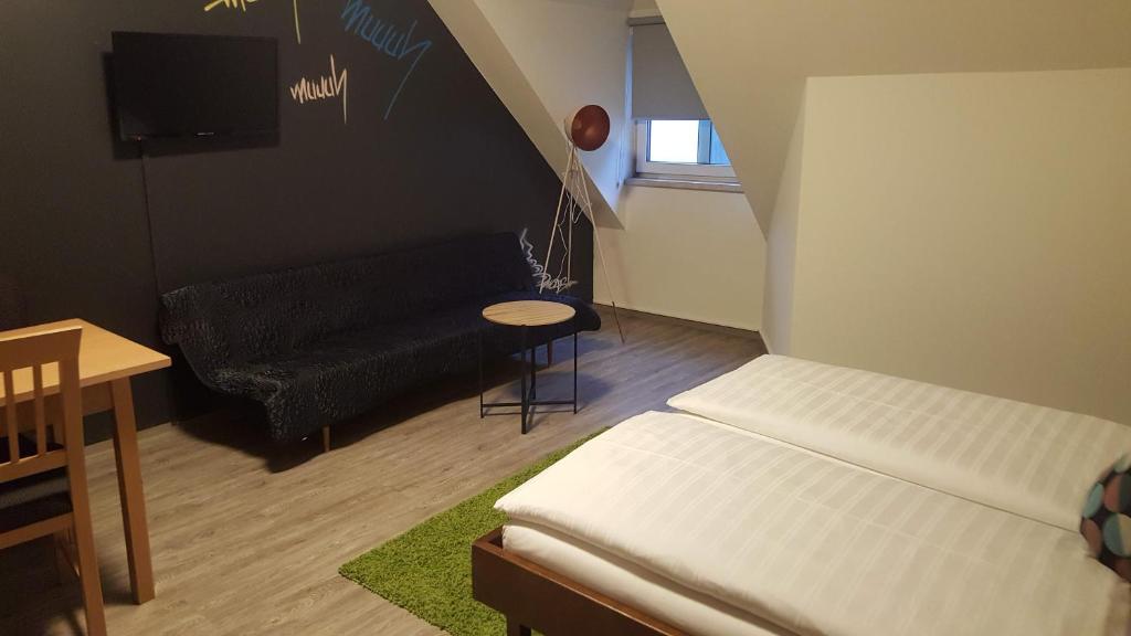 Postel nebo postele na pokoji v ubytování Mama Muh Self-Check-in