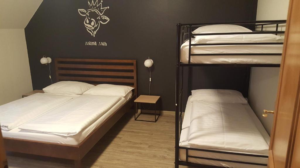 Postel nebo postele na pokoji v ubytování Mama Muh Self-Check-in