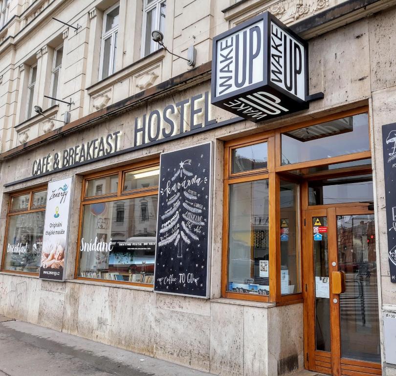 a restaurant with a sign that reads take a breakfast house at Wake Up Wellness Hostel in Brno