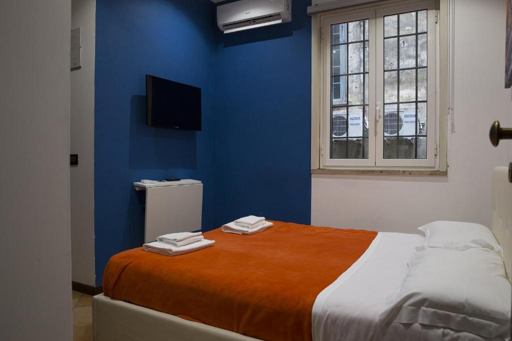 Postel nebo postele na pokoji v ubytování Trasteverome45