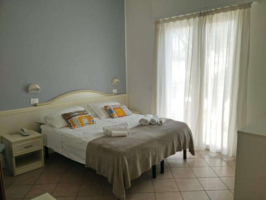Postel nebo postele na pokoji v ubytování Hotel Garnì Anna